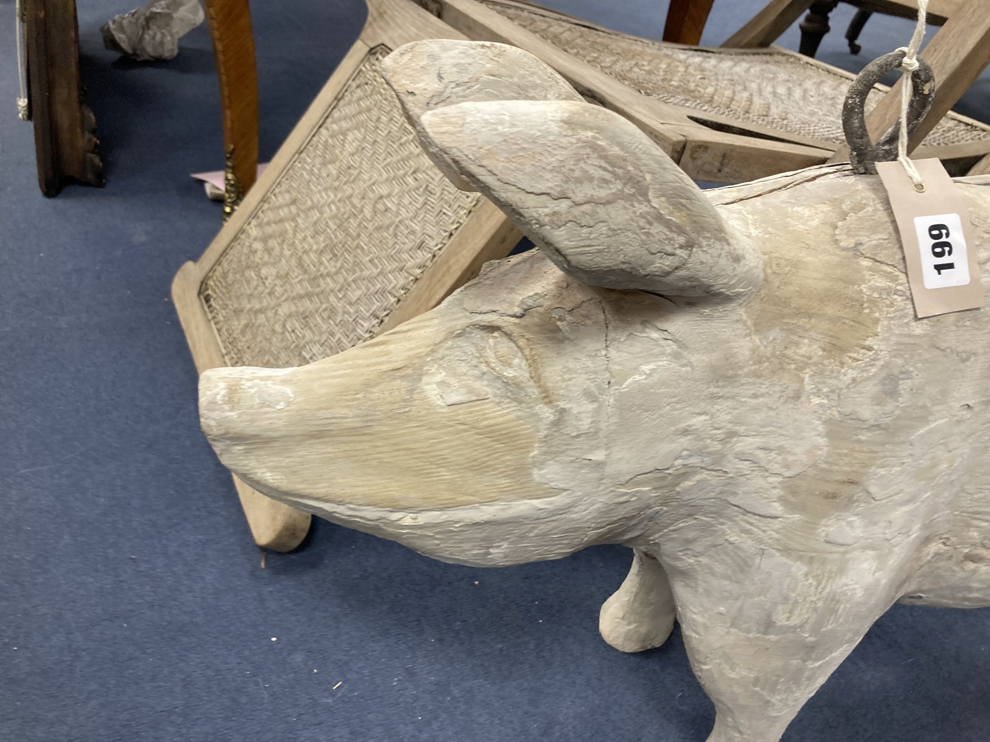 A carved wood butchers shop model of a pig, length 76cm